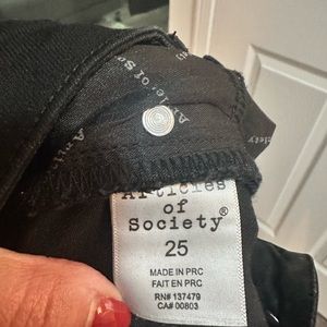 Articles of Society black skinny jeans.